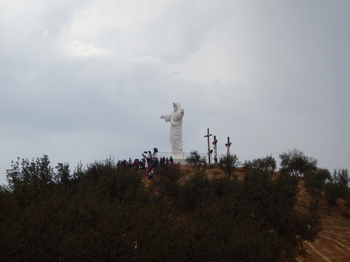 Jesus overlooks from the hill.